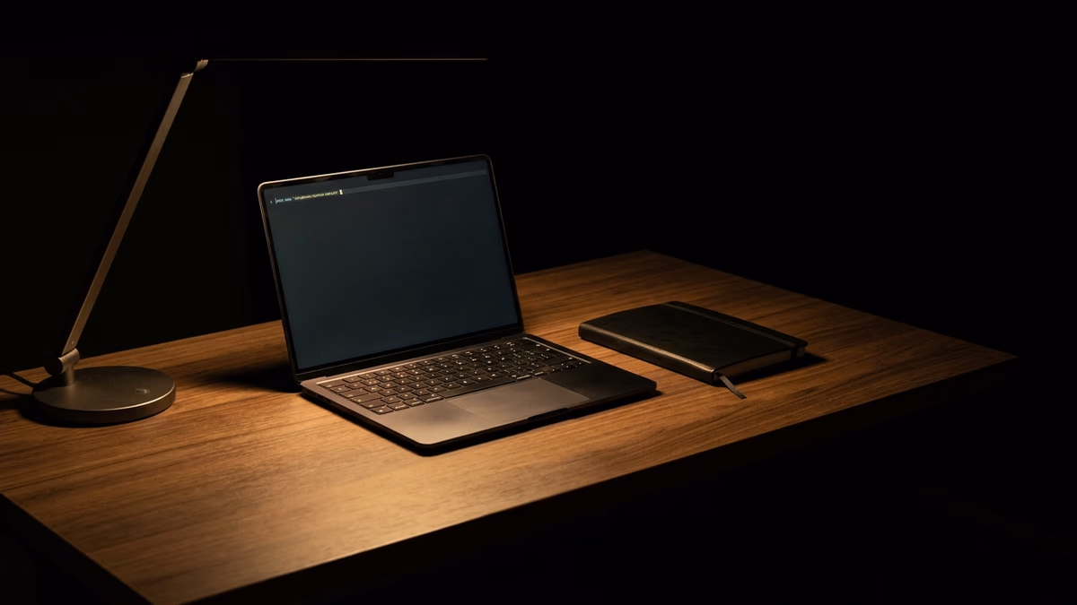 Organized dark minimal workspace with only essential tools visible, representing friction reduction for productivity and stopping procrastination
