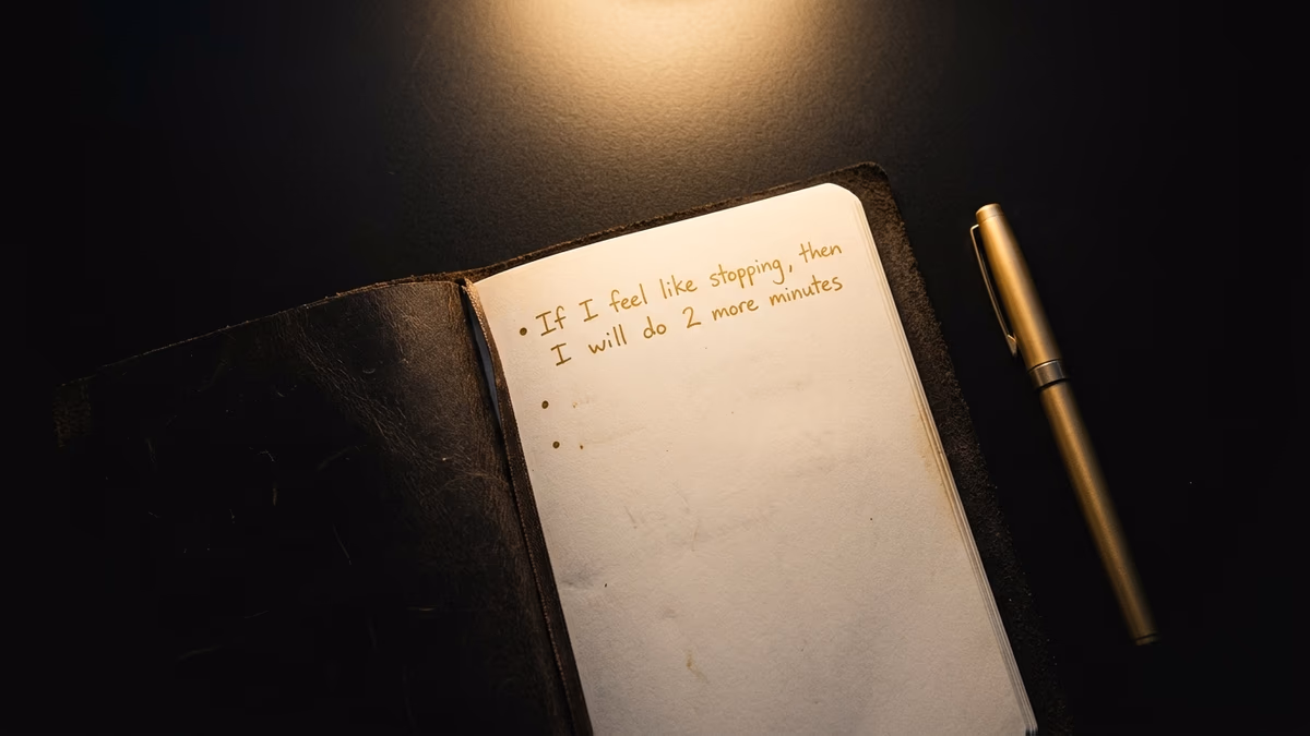 Notebook with a written if-then implementation intention plan for building a daily discipline habit